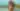 Woman in Patterned Bikini at Rocky Beach Shore - free people & portraits wallpaper 1920×1080