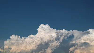 Towering Cumulus Against Azure Sky - free nature wallpaper 6016×3384