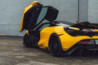 Yellow McLaren Sports Car with Open Doors Displayed - free wallpaper 2048×1365