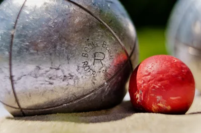 Lawn Bowls and Jack on Sandy Surface - free sports wallpaper 6232×4141