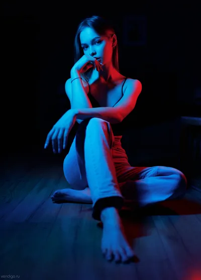 Woman in Neon Blue and Red Lighting Seated Pose - free people & portraits wallpaper 3675×5120