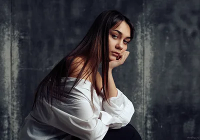 Contemplative Woman in White Shirt Against Gray Wall - free people & portraits wallpaper 5829×4085