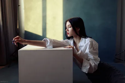 Woman in White Shirt Leaning on Cube in Sunlit Room - free people & portraits wallpaper 6109×4073