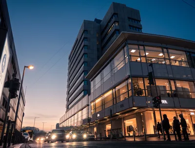 Modern Urban Street at Dusk with Retail Storefronts - free city & urban wallpaper 4855×3700