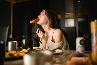 Woman Eating Sausage at Dining Table - free people & portraits wallpaper 2500×1667