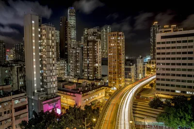 Urban Nighttime Cityscape with Light Trails and Towers - free city & urban wallpaper 5760×3840