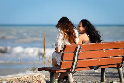 Two Women Sitting on Beach Bench Overlooking Ocean - free people & portraits wallpaper 5798×3865