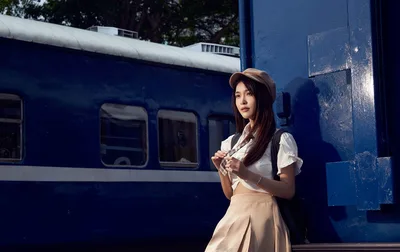 Woman in Casual Outfit Posing by Blue Train - free wallpaper 5060×3187