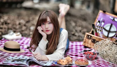 Girl Reading Magazine at Outdoor Picnic Setup - free wallpaper 5616×3230
