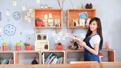 Woman Displaying Advent Calendar Display Against Decorated Wall - free people & portraits wallpaper 5691×3201