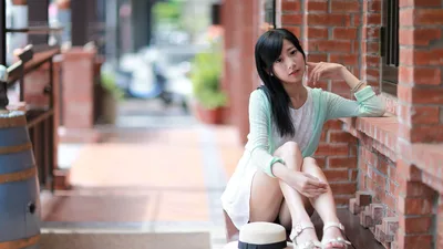 Young Woman Sitting in Traditional Brick Alleyway - free people & portraits wallpaper 5760×3240