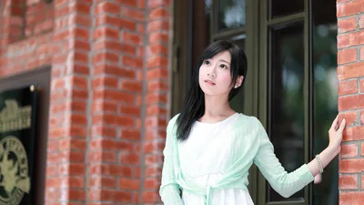 Young Woman in Green and White Dress by Brick Building - free people & portraits wallpaper 5760×3240