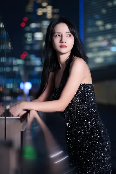 Woman in Sequined Dress Against Nighttime City Backdrop - free people & portraits wallpaper 3413×5120