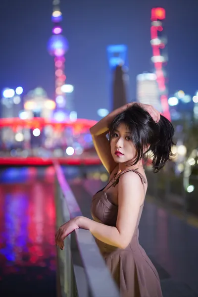 Woman in Evening Dress Against Neon City Skyline - free people & portraits wallpaper 2686×4032