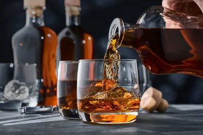 Pouring Whiskey Into Glass With Bottles - free food wallpaper 6016×4016
