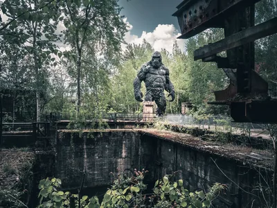 Giant Stone Creature Statue in Overgrown Industrial Ruins - free animals wallpaper 4427×3324