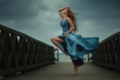 Woman in Blue Dress on Wooden Pier Under Stormy Sky - free people & portraits wallpaper 2034×1356