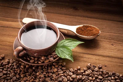 Steaming Coffee Cup With Beans and Ground Coffee - free wallpaper 5616×3744