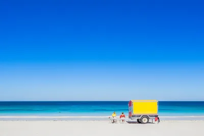 Beach Vendor Cart with Swimmers in Turquoise Waters - free landscapes wallpaper 2048×1365