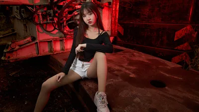 Woman in Black Top and White Shorts in Industrial Red Setting - free people & portraits wallpaper 5184×2916