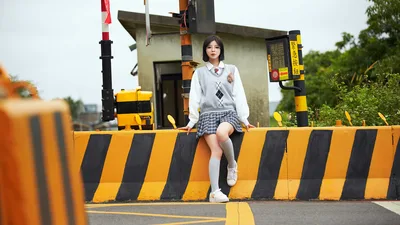 Student Posing at Railway Crossing Barrier - free wallpaper 5184×2916