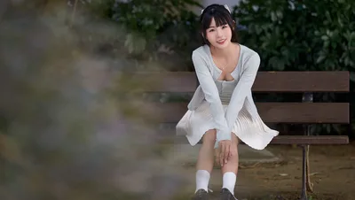 Young Woman Sitting on Wooden Bench in Garden - free wallpaper 4592×2590