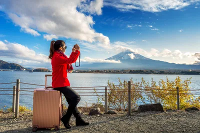 Tourist Photographing Mount Fuji by Lake with Luggage - free people & portraits wallpaper 4928×3280