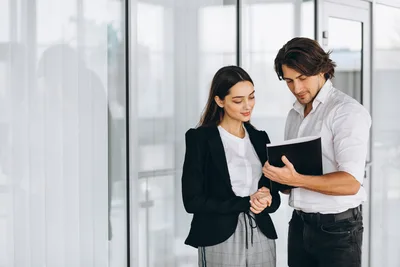 Business Professionals Reviewing Document in Modern Office - free people & portraits wallpaper 5040×3360