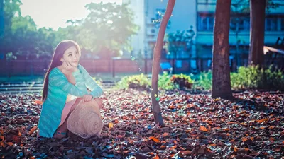 Woman in Turquoise Jacket Posing by Tree in Urban Park - free people & portraits wallpaper 5760×3240