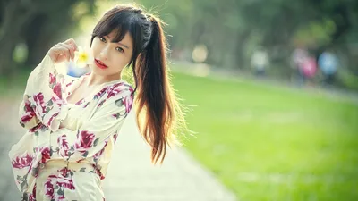Woman in Floral Áo Dài in Park Setting - free people & portraits wallpaper 5760×3240