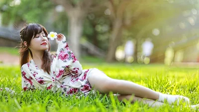 Woman in Floral Dress Holding Flower on Grass - free people & portraits wallpaper 5760×3240