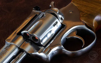 Classic Revolver with Wood Grip on Fabric Surface - free architecture wallpaper 1920×1200