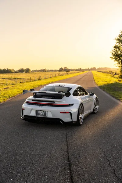 White Porsche 911 on Rural Country Road at Sunset - free cars & vehicles wallpaper 6336×9504