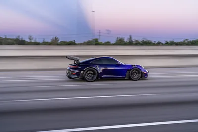 Blue Porsche 911 GT3 Racing on Highway at Dusk - free cars & vehicles wallpaper 9504×6336