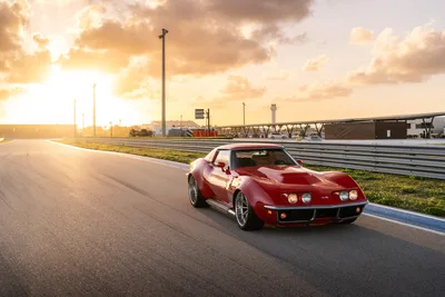 Red Sports Car On Race Track At Sunset - free cars & vehicles wallpaper 9504×6336