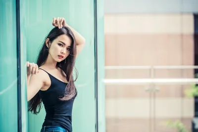 Woman in Black Tank Top Against Turquoise Wall - free people & portraits wallpaper 2048×1366