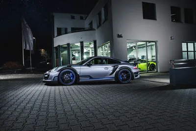 Silver Porsche 911 Turbo At Night In Modern Showroom - free cars & vehicles wallpaper 3000×2000