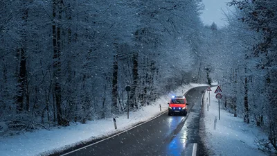 Emergency Vehicle on Snowy Forest Road in Winter - free cars & vehicles wallpaper 3810×2143
