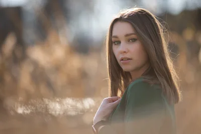 Young Woman in Green Jacket Gazing Outdoors - free people & portraits wallpaper 4906×3271