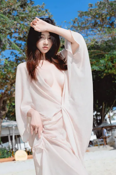 Woman in Pale Pink Wrap Dress Under Sunny Trees - free people & portraits wallpaper 4000×6000