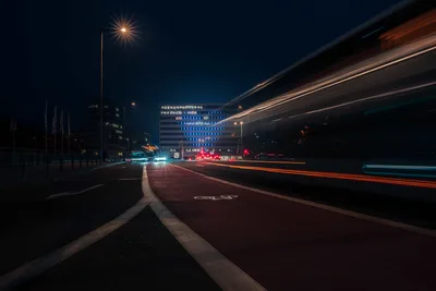 Urban Highway at Night with Light Trails and City Lights - free wallpaper 5967×3978