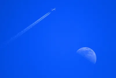 Aircraft With Contrail Flying Past Daytime Moon - free cars & vehicles wallpaper 2789×1859