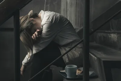 Woman in Contemplative Pose in Wooden Attic Space - free wallpaper 2500×1667