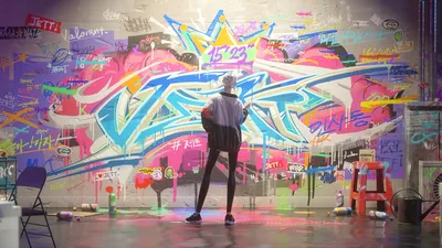 Artist Admiring Vibrant Graffiti Wall in Studio - free art & design wallpaper 3840×2160