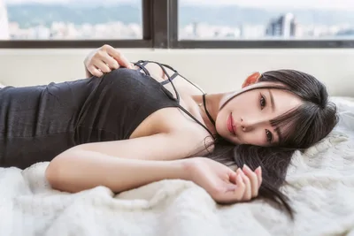 Young Woman Lying on White Carpet by Window - free people & portraits wallpaper 5834×3895