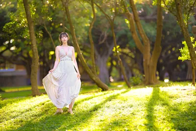 Woman in White Dress Walking Through Tree-Lined Park - free people & portraits wallpaper 6144×4095