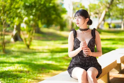 Young Woman Sitting in Park With Beverage - free people & portraits wallpaper 6144×4096