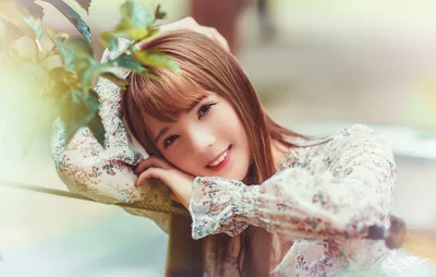 Young Woman in Floral Dress Posing With Plant Branch - free people & portraits wallpaper 5120×3249