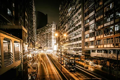 Night Street Scene With Light Trails and Tall Buildings - free city & urban wallpaper 5120×3413