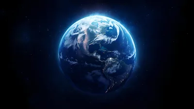 Earth at Night in Space with Atmospheric Glow - free space wallpaper 5120×2880